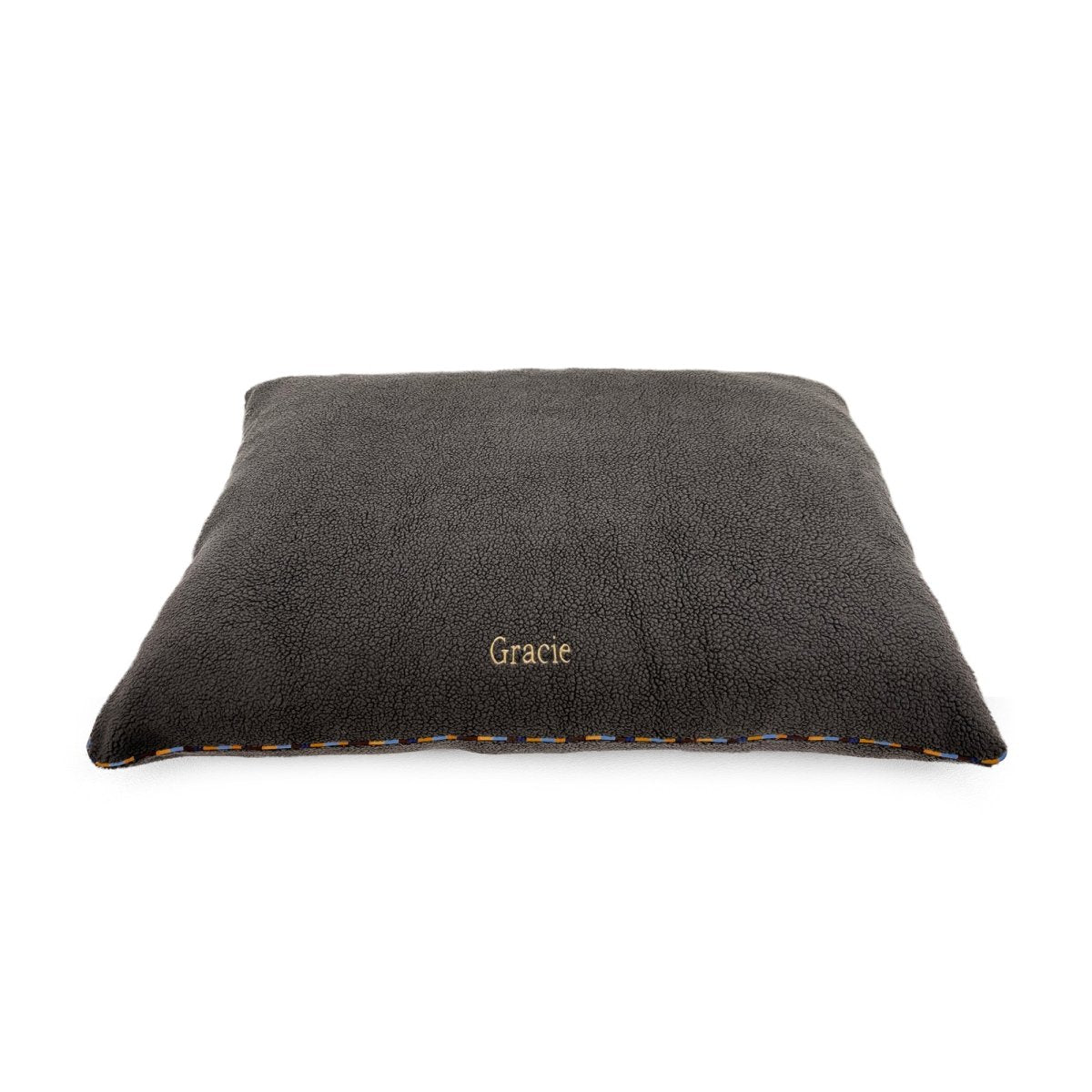 Orthopedic Foam Sherpa Pillow Dog Bed in a living room setting