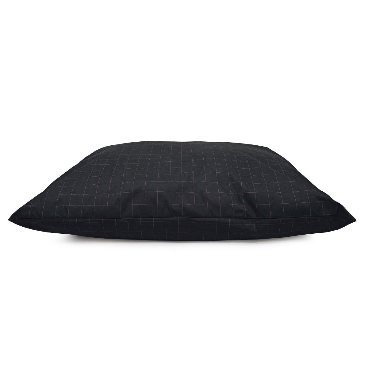 Patio Pillow Dog Bed on a covered porch